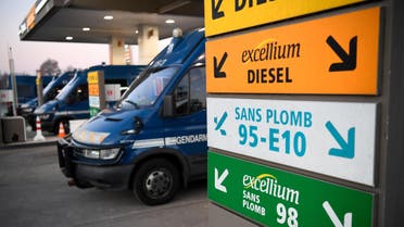 French Gendarmerie trucks are parked in a petrol station close to a fuel depot after its access was cleared by Gendarmes in Vern-sur-Seiche, near Rennes, western France, on December 3, 2019. (AFP)