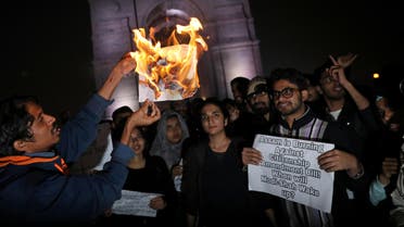 Demonstrators burn a copy of the Citizenship Amendment Bill during a protest in New Delhi on December 12, 2019. (Photo: Reuters)