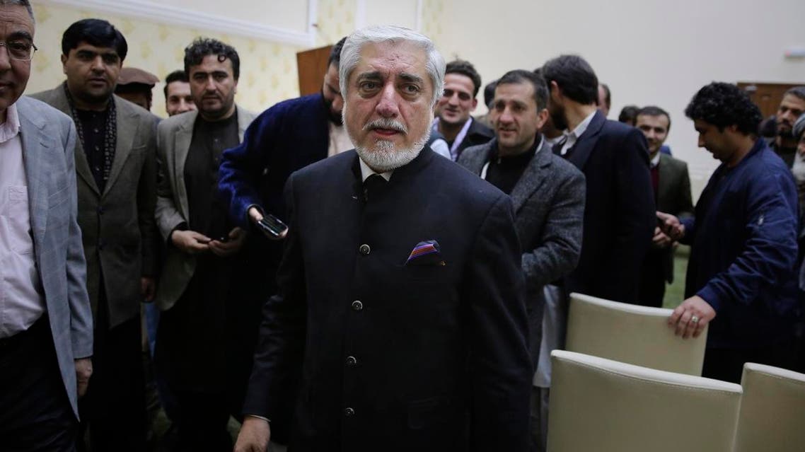 Afghan presidential candidate Abdullah Abdullah, leaves after addressing the media following a conference with his party members and few candidates in Kabul. (AP)