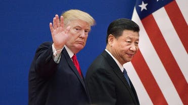File photo shows US President Donald Trump and China's President Xi Jinping leaving a business leaders event at the Great Hall of the People in Beijing. (AFP)