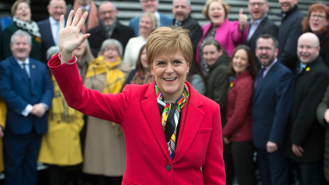 Scottish National Party (SNP) leader and Scotland's First Minister Nicola Sturgeon poses with SNP's newly elected MPs during a photo call outside the V & A Museum in Dundee, Scotland on December 14, 2019.