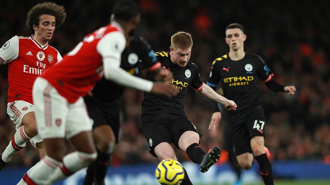 Manchester City’s Kevin De Bruyne (second right), scores his side’s third goal during the English Premier League soccer match at the Emirates Stadium in London, on December 15, 2019. (AP)