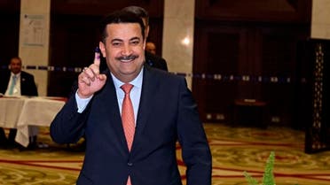 Mohammed Shia al-Sudani, Minister of Labor and Social Affairs shows his ink-stained finger after casting his vote in the country’s parliamentary elections in Baghdad, May 12, 2018. (File photo: AP)