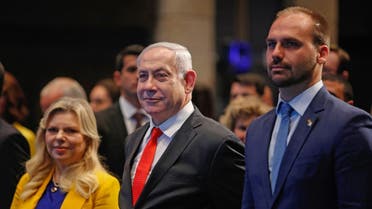 Israeli PM Netanyahu (L) and Brazilian Federal Deputy Eduardo Bolsonaro (R) attend the opening ceremony of the Brazilian Ministry trade office in Jerusalem on December 15, 2019. (AFP)