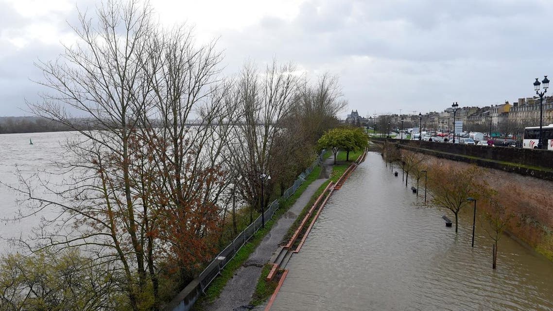 This picture taken on December 13, 2019 in Bordeaux, southwestern France, shows the Garonne river’s overflooded bank following strong winds and heavy rains. (AFP)