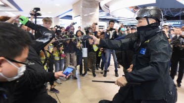 Police deploy pepper spray during a protest at the New Town Plaza shopping mall in Shatin in Hong Kong on December 15, 2019. (AFP)