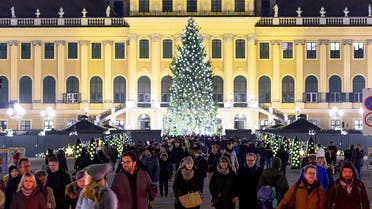Visitors explore a Christmas market in front at Schoenbrunn palace in Vienna, Austria. (File photo: AFP)