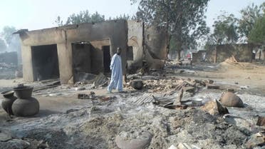 Jan. 31, 2016 file photo, a man walks past burnt out houses following an attacked by Boko Haram in Dalori village near Maiduguri (AP)