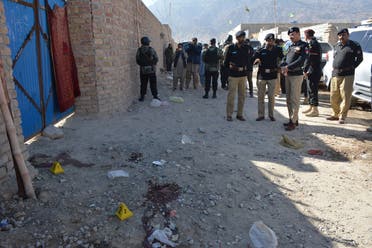 Pakistani police officials gather at the site of an attack by gunmen on a polio vaccination team on the outskirts of Quetta on January 18, 2018. (AFP)