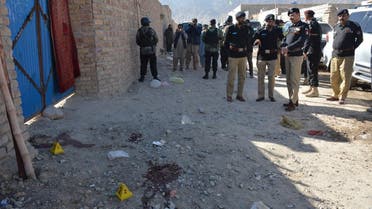 Pakistani police officials gather at the site of an attack by gunmen on a polio vaccination team on the outskirts of Quetta on January 18, 2018. (AFP)