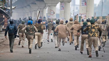 Policemen chase protesters during a protest against a new citizenship law at the Seelampur area of New Delhi, India, Tuesday, Dec. 17, 2019. (AP)
