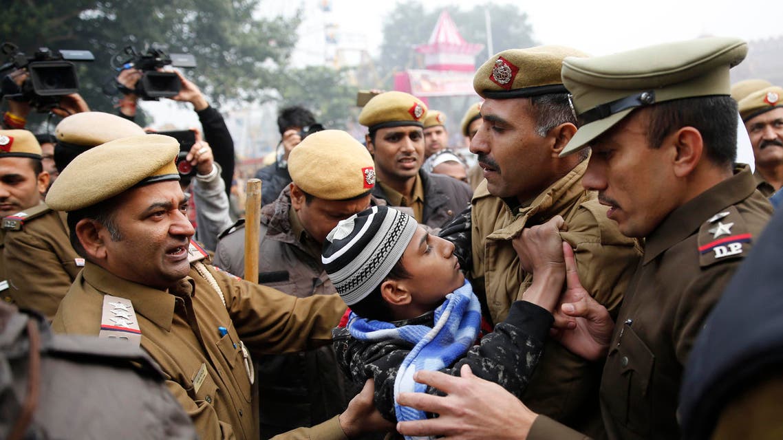 A young protestor tries to resist as police officers detain him during a march near the historic Red Fort in New Delhi on Dec. 19, 2019. (AP)
