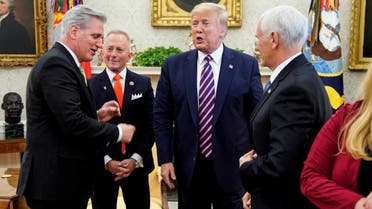 House Minority Leader Kevin McCarthy (R-CA) points to US President Donald Trump as he meets with US Representative Jeff Van Drew (D-NJ), a Democratic lawmaker who opposed his party's move to impeach Trump, in the Oval Office of the White House in Washington, US, on December 19, 2019. (Reuters)