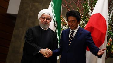 Japanese Prime Minister Shinzo Abe and Iranian President Hassan Rouhani meet in Tokyo, Japan, on December 20, 2019. (Reuters)