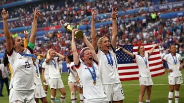 United States' Megan Rapinoe, center, holds the trophy as she celebrates with teammates after they defeated the Netherlands 2-0 in the Women's World Cup final soccer match at the Stade de Lyon in Decines, outside Lyon, France, Sunday, July 7, 2019. (AP)