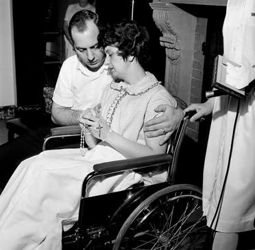 Fingering the rosary, Dora and Chester Fronczak are pictured as they pray for the return of their kidnapped son in Chicago, April 30, 1964. (AP)