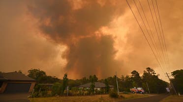 A large bushfire burns near houses in Bargo, southwest of Sydney on December 21, 2019. (AFP)