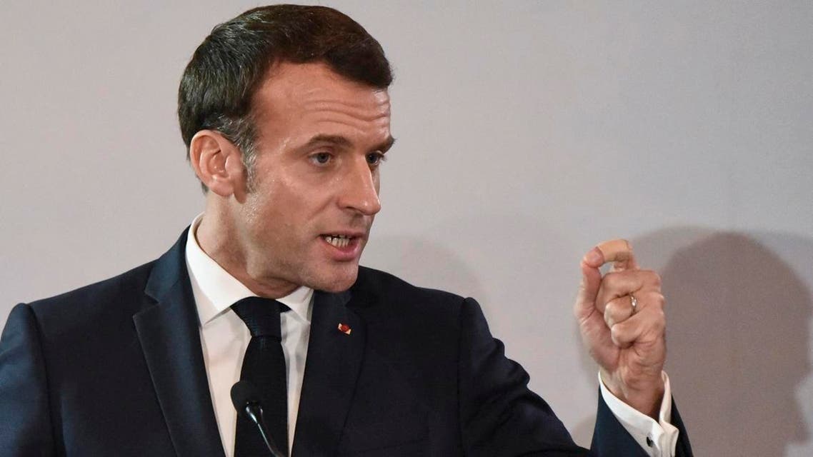 French President Emmanuel Macron gestures during a press conference at the Presidential Palace in Abidjan on December 21, 2019, as part of a three day visit to West Africa. (AFP)