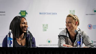 Serena Williams, left, laughs with Caroline Wozniacki during a news conference in New York. (File photo: AP)
