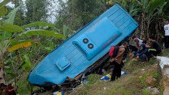 Train crashes into minibus, killing at least 11 people in Indonesia