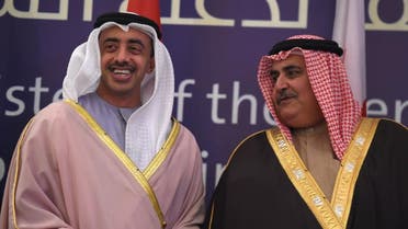 UAE's Minister of Foreign Affairs and International Cooperation Sheikh Abdullah bin Zayed bin Sultan al Nahyan (L) speaks with his Bahraini counterpart Khalid bin Ahmed al-Khalifa. afp