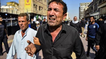 Iraqis mourn a demonstrator reportedly killed the day before during anti-government protests in the eastern city of Diwaniya, during his funeral in the central holy shrine city of Najaf on October 26, 2019.
