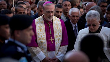The Latin Patriarch of Jerusalem Pierbattista Pizzaballa arrives to the Church of the Nativity, built atop the site where Christians believe Jesus Christ was born, on Christmas Eve, in the West Bank City of Bethlehem, Tuesday, Dec. 24, 2019. (AP