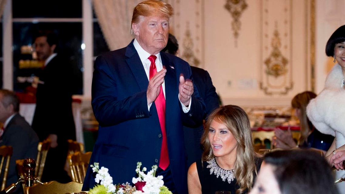 President Donald Trump and first lady Melania Trump arrive for Christmas Eve dinner at Mar-a-lago in Palm Beach, Florida, on December 24, 2019. (AP)