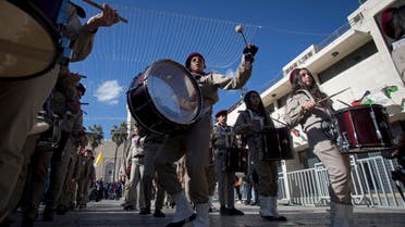 A Palestinian Scout marching band parades during Christmas celebrations outside the Church of the Nativity, built atop the site where Christians believe Jesus Christ was born. (AP)