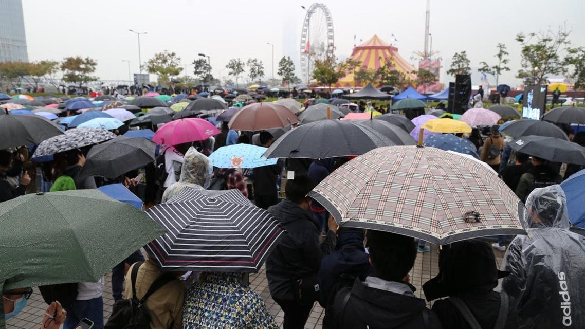 More than 1,000 people rallied in the rain in a park in Hong Kong’s financial district on Sunday, chanting slogans for democracy. (via Twitter)