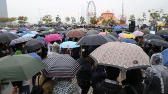 More than 1,000 gather for rain-soaked Hong Kong rally