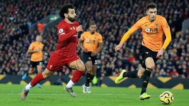 Liverpool’s Mohamed Salah (left), runs with the ball during the English Premier League soccer match against Wolverhampton Wanderers at Anfield Stadium, Liverpool, England, on December 29, 2019. (AP)