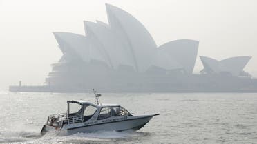 A water taxis drives by as smoke haze hangs over the Sydney Opera House in Sydney, Thursday, Nov. 21, 2019. (AP)