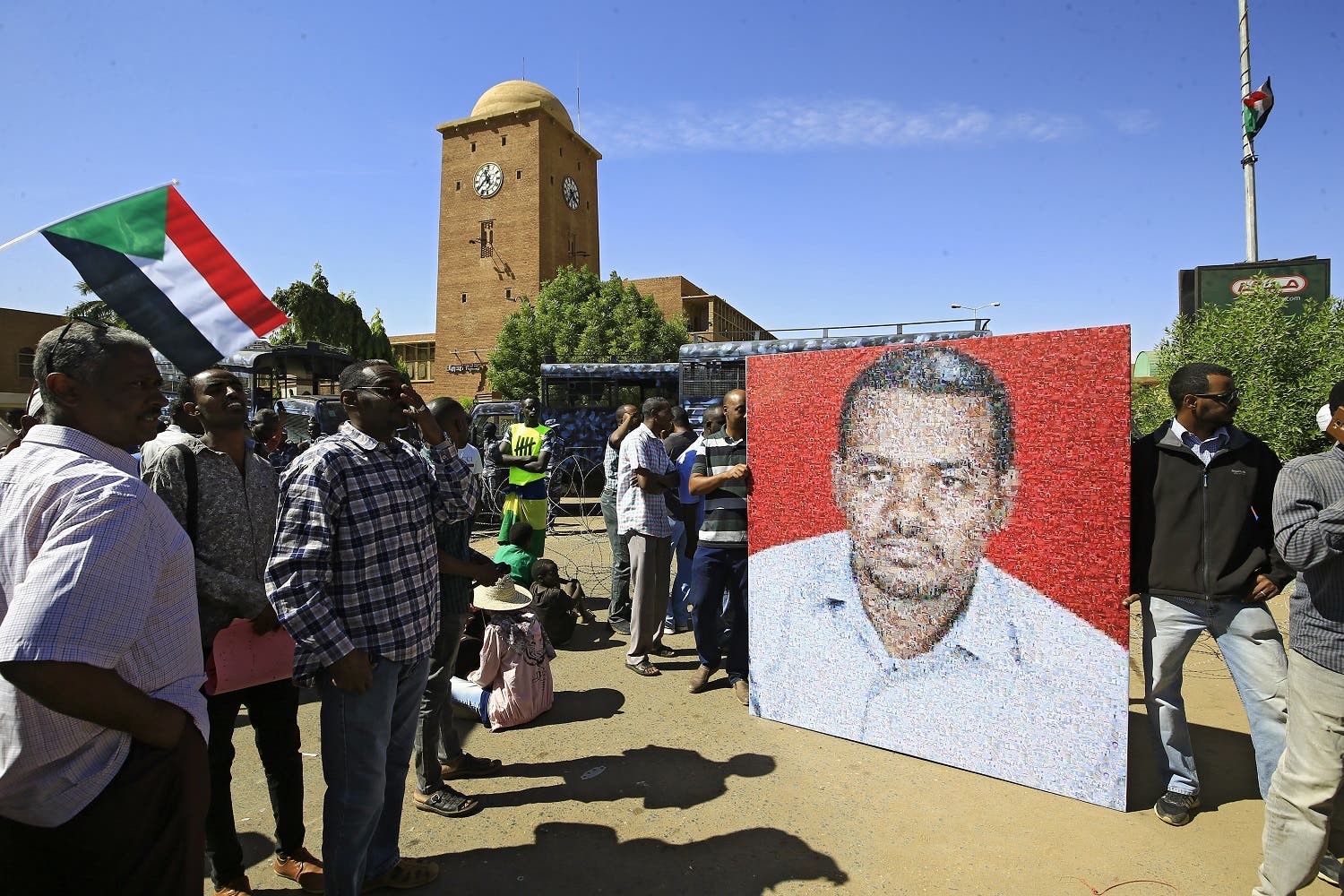 Sudanese protesters rally in front of a court in Omdurman near the capital Khartoum, on December 30, 2019, during the trial of intelligence agents for the death of teacher Ahmed Al-Khair (picture) while in custody of intelligence services. The court sentenced 27 intelligence agents to death by hanging, for torturing and killing the teacher at an intelligence services facility during protests a year ago, judge Sadok Albdelrahman said. (Photo: AFP)