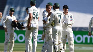 New Zealand and Australian players shake hands after the cricket test match in Melbourne, Australia, on December 29, 2019. (AP)