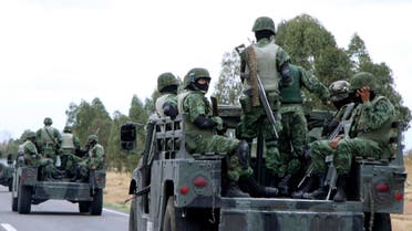 Soldiers patrol near Cieneguillas state prison in Zacatecas, Mexico, Sunday, May 17, 2009. (AP)