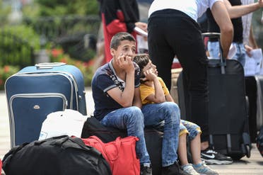 لاجئون سوريون مرحلون من تركيا (فرانس برس)