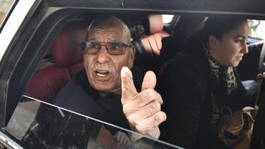 Algerian war veteran Lakhdar Bouregaa gestures in a car upon his release in Algiers on January 2, 2020. (AFP)