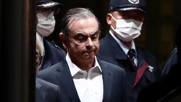 In this file photo taken on April 25, 2019 former Nissan chairman Carlos Ghosn (C) is escorted as he walks out of the Tokyo Detention House following his release on bail in Tokyo. (File photo: AFP)