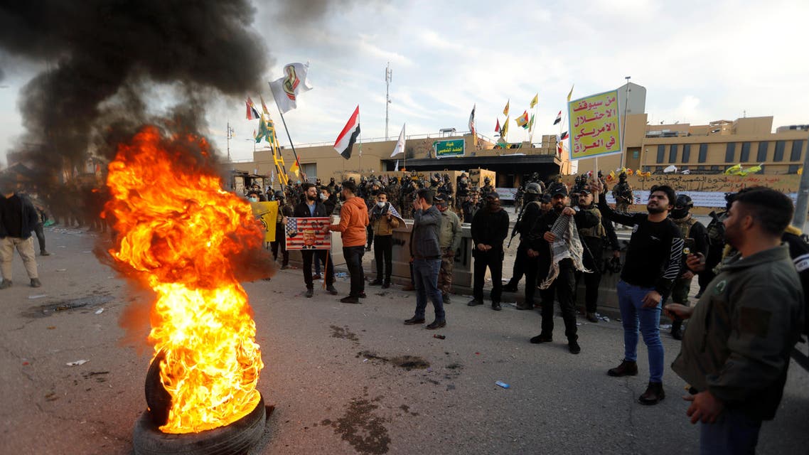 Protesters and militia fighters burn tires outside the US Embassy in Baghdad on January 1, 2020. (Photo: Reuters)