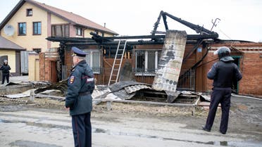 Police officers guard the scene at a private residence where two supporters of the Islamic State group were killed in a shootout with security forces in Tyumen, about 1700 kilometers (1100 miles) east of Moscow, Russia, Saturday, April 13, 2019. (AP)