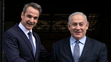 Greece's Prime Minister Kyriakos Mitsotakis, left, welcomes his Israeli counterpart Benjamin Netanyahu in Athens, Thursday, Jan. 2, 2020. (AP)