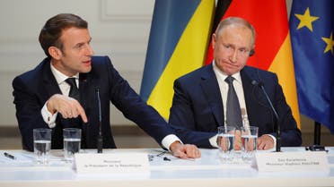 French President Emmanuel Macron and Russia's President Vladimir Putin attend a joint news conference after a Normandy-format summit in Paris, France December 9, 2019. REUTERS/Charles Platiau/Pool