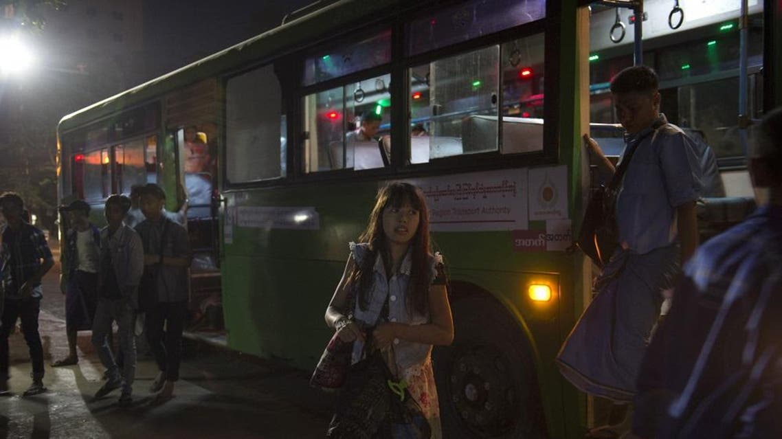 This photo taken on December 3, 2017 shows a woman figuring out her next move after stepping off a bus in Yangon. Lillian SUWANRUMPHA / AFP