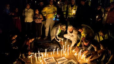 Journalists and community members take part in a vigil in Johannesburg on January 18, 2017 to demand the release of the South African photojournalist Shiraaz Mohamed, who was kidnapped at gunpoint in northwestern Syria, near the Turkish border last week. MARCO LONGARI / AFP