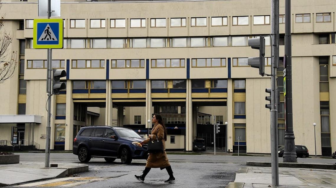 A woman walks past the Moscow headquarters of Russia's Rossiya Segodnya state media group that runs the Sputnik news agency on November 12, 2017. (File photo: AFP)