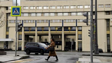 A woman walks past the Moscow headquarters of Russia's Rossiya Segodnya state media group that runs the Sputnik news agency on November 12, 2017. (File photo: AFP)