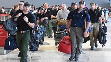 A contingent of 39 firefighters from the United states and Canada arrive at Melbourne Airport in Melbourne, Thursday, January 2, 2020. The firefighters will assist local crews with ongoing fires burning across Victoria. (AP)