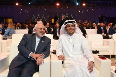 Javad Zarif, Iran Foreign Affairs Minister (L) and Sheikh Mohammed bin Abdulrahman bin Jassim Al Thani, Foreign Affairs Minister of Qatar (R) attend the Doha Forum 2019 in Doha, Qatar, December 15th of 2019. (File photo: AFP)