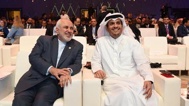 Javad Zarif, Iran Foreign Affairs Minister (L) and Sheikh Mohammed bin Abdulrahman bin Jassim Al Thani, Foreign Affairs Minister of Qatar (R) attend the Doha Forum 2019 in Doha, Qatar, December 15th of 2019. (File photo: AFP)